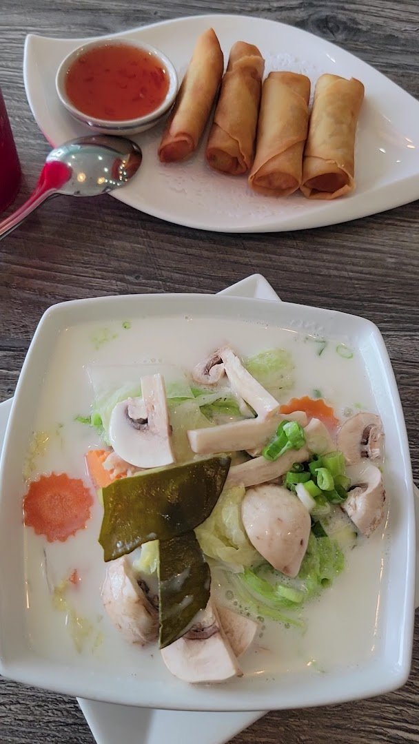 Colorful Thai dishes in a cozy restaurant.
